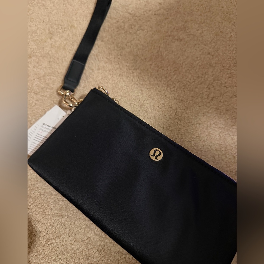 Lululemon Athletica Curved Wristlet new with tags black and gold